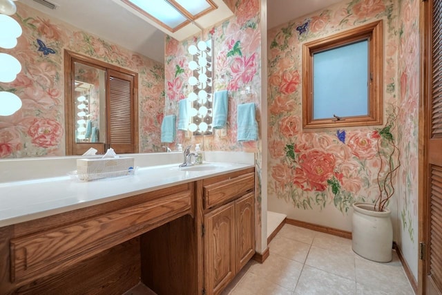 bathroom featuring tile patterned floors and vanity