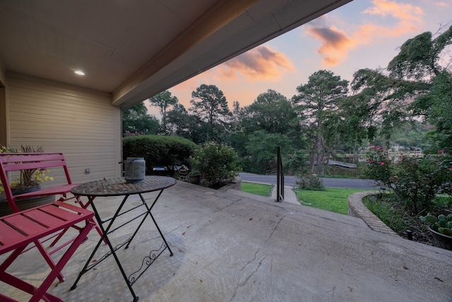 view of patio terrace at dusk