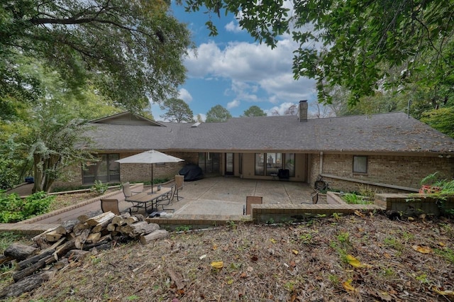 back of property featuring a patio area