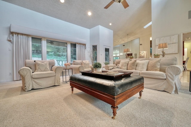 carpeted living room featuring ceiling fan, a towering ceiling, and a textured ceiling