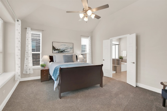 carpeted bedroom featuring ensuite bath, ceiling fan, and vaulted ceiling