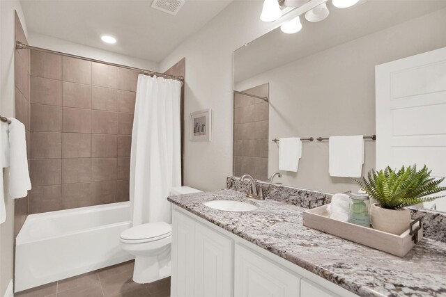 full bathroom featuring vanity, toilet, and shower / bath combo