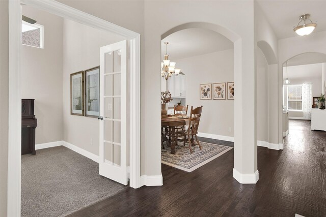 dining room with a chandelier and dark hardwood / wood-style flooring