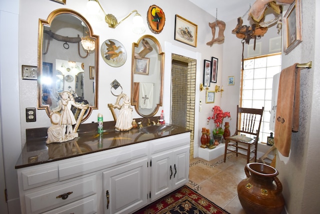 bathroom featuring tile patterned flooring and vanity