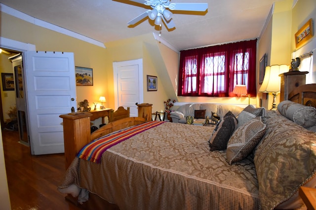 bedroom featuring crown molding, dark hardwood / wood-style flooring, and ceiling fan