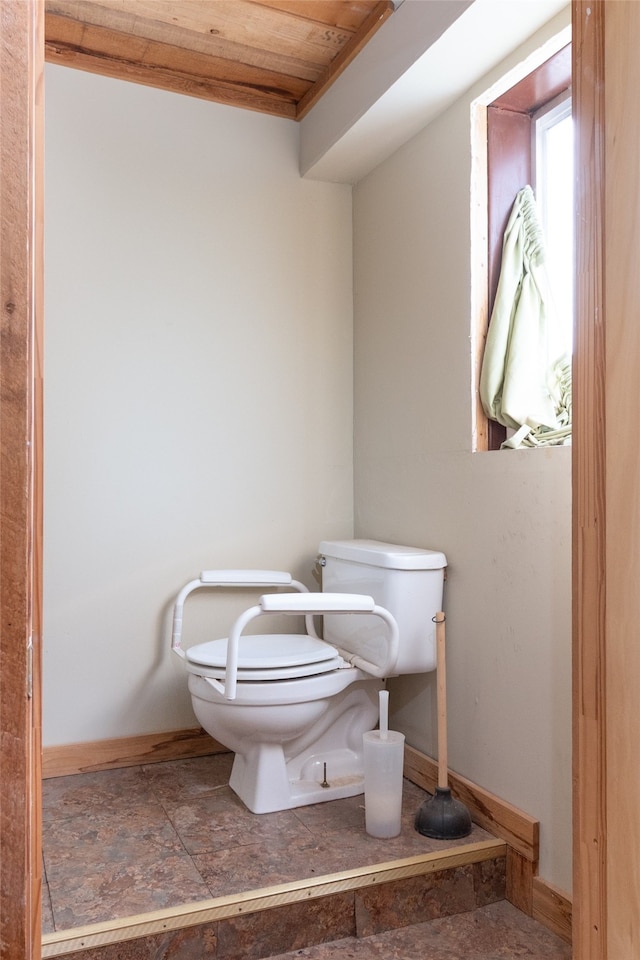 bathroom with toilet and wooden ceiling