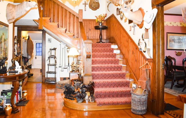 stairway featuring crown molding and tile patterned flooring