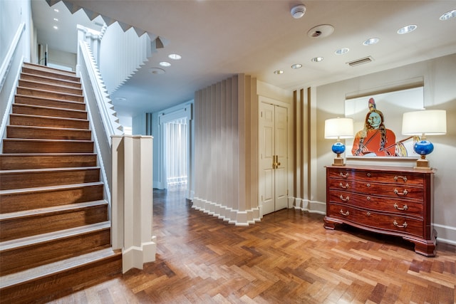 stairway with parquet flooring