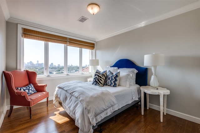 bedroom featuring dark hardwood / wood-style floors and crown molding