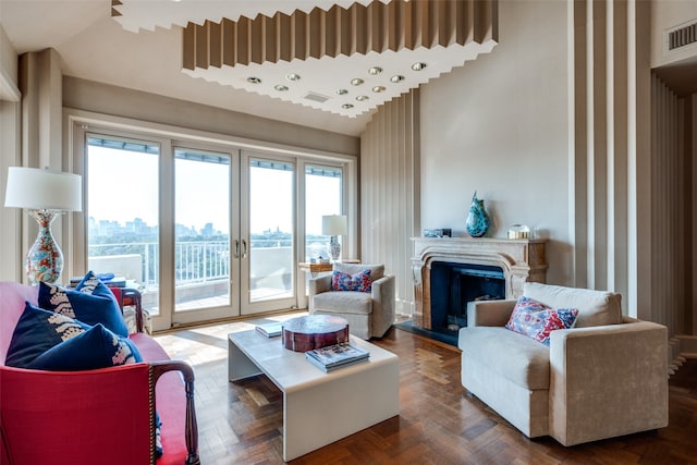 living room with parquet flooring, vaulted ceiling, and a healthy amount of sunlight