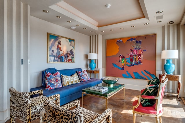 living room featuring a tray ceiling