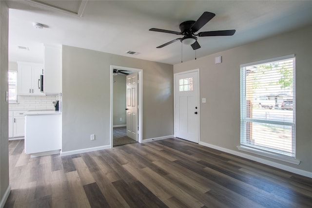 foyer with a healthy amount of sunlight and dark hardwood / wood-style floors