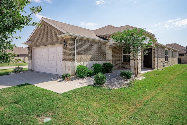 ranch-style home with a front yard and a garage