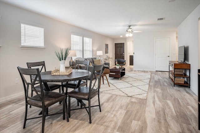 dining area featuring light hardwood / wood-style flooring and sink