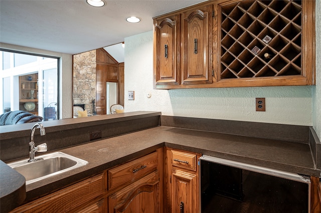 kitchen with wine cooler and sink