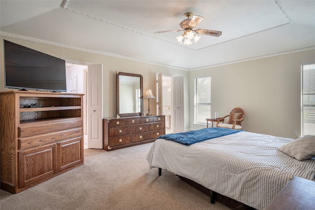 carpeted bedroom featuring crown molding and ceiling fan