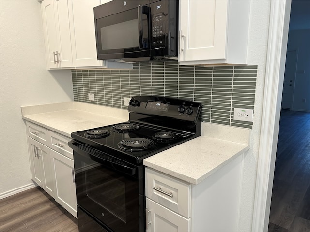 kitchen with black appliances, white cabinetry, wood-type flooring, and tasteful backsplash