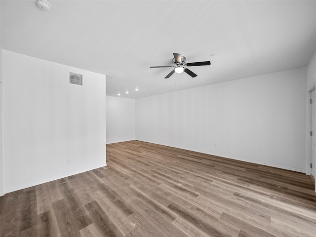 spare room with light hardwood / wood-style flooring and ceiling fan