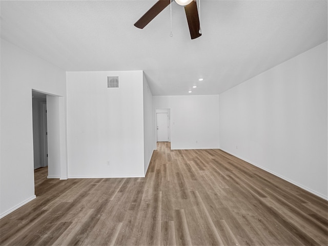 unfurnished living room featuring light hardwood / wood-style floors and ceiling fan