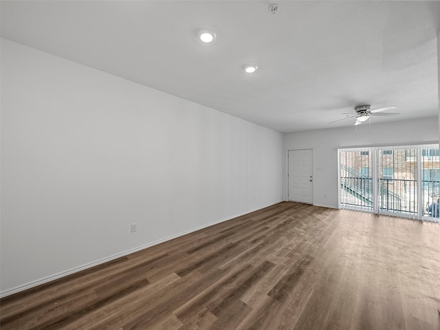 spare room featuring ceiling fan and hardwood / wood-style flooring