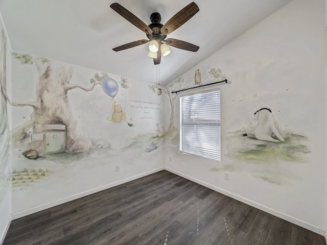 unfurnished room featuring vaulted ceiling, dark hardwood / wood-style floors, and ceiling fan