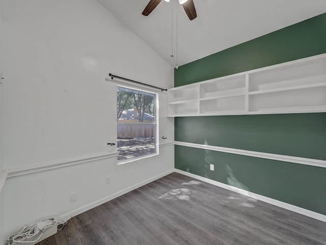 empty room with ceiling fan, high vaulted ceiling, and wood-type flooring