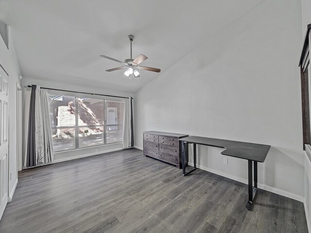 interior space featuring vaulted ceiling, ceiling fan, and dark hardwood / wood-style flooring