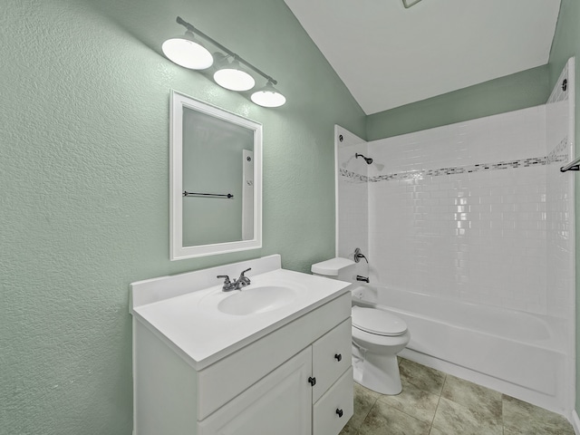 full bathroom featuring lofted ceiling, tile patterned floors, toilet, vanity, and washtub / shower combination