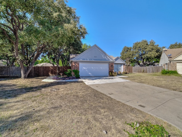 exterior space with a front yard and a garage