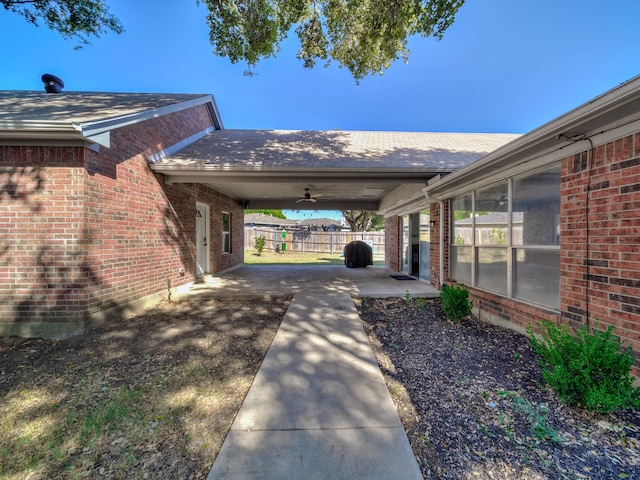 view of side of property featuring ceiling fan