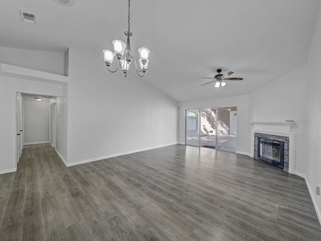 unfurnished living room with lofted ceiling, ceiling fan with notable chandelier, a fireplace, and dark hardwood / wood-style flooring