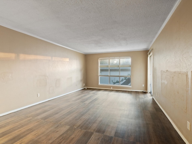 empty room with a textured ceiling, dark hardwood / wood-style floors, and crown molding