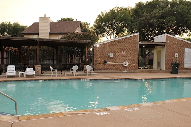 view of swimming pool with a patio area