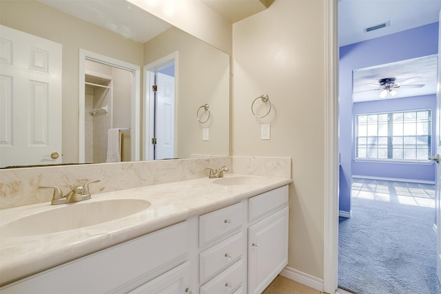 bathroom featuring ceiling fan and vanity