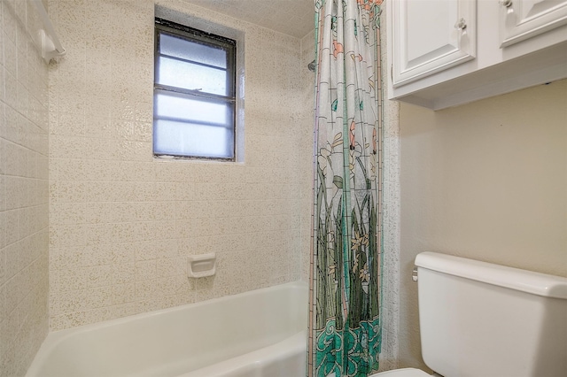 bathroom with toilet and shower / bath combo with shower curtain