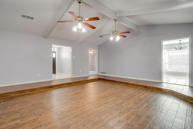 carpeted spare room with ceiling fan and a wealth of natural light