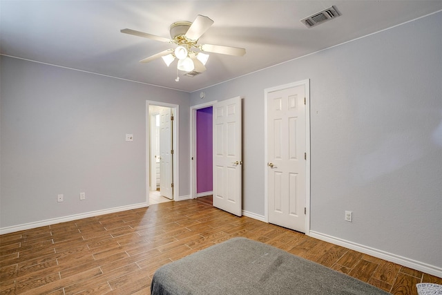 bedroom featuring hardwood / wood-style flooring and ceiling fan