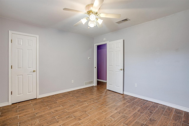 unfurnished room featuring ceiling fan and light hardwood / wood-style flooring