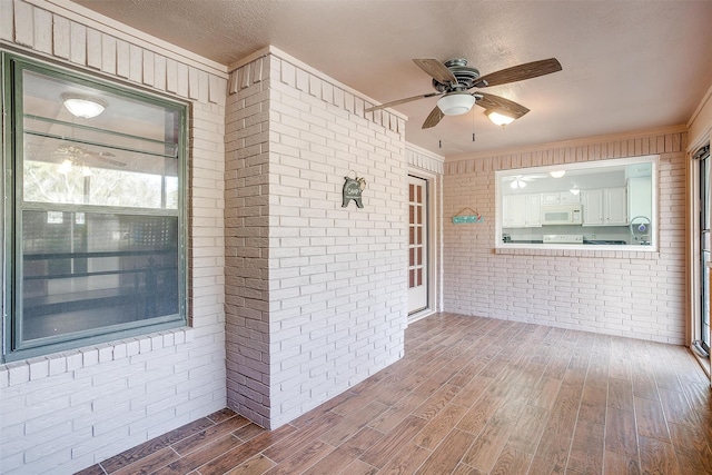 interior space featuring ceiling fan