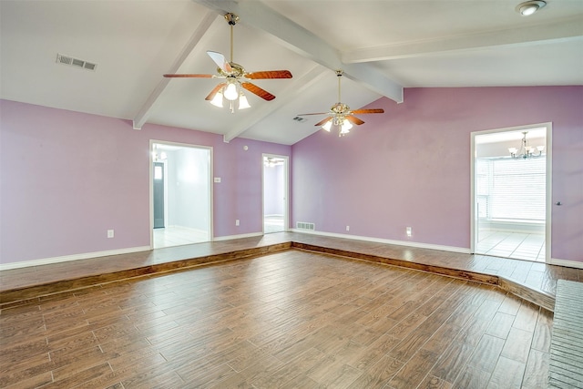 spare room featuring hardwood / wood-style flooring, vaulted ceiling with beams, and ceiling fan with notable chandelier