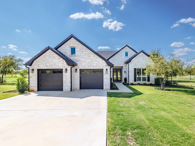 view of front of property featuring a garage and a front yard