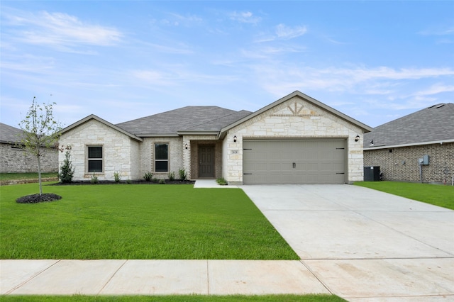 view of front of property featuring a front lawn and a garage