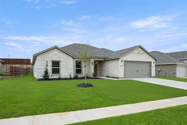 view of front facade with a front lawn and a garage