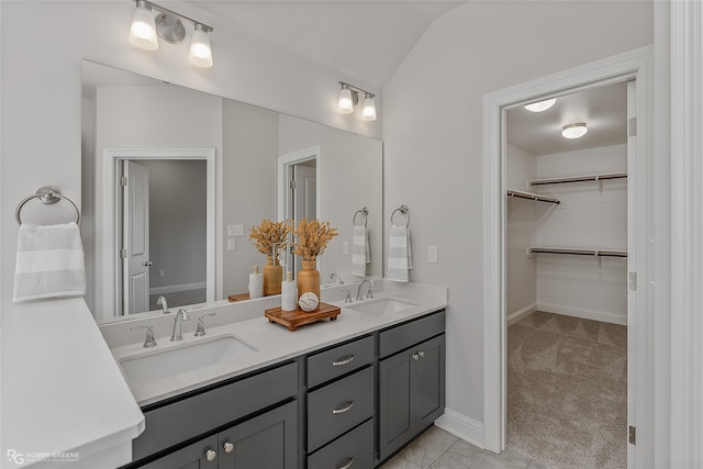 bathroom featuring vanity and vaulted ceiling