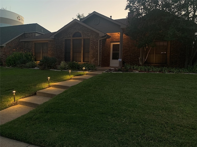 view of front of house with a lawn