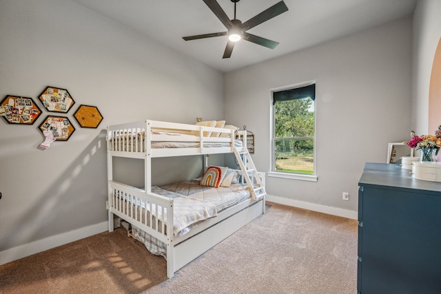 bedroom with ceiling fan and light colored carpet