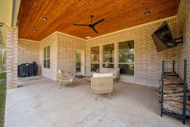 view of patio / terrace with ceiling fan and a grill