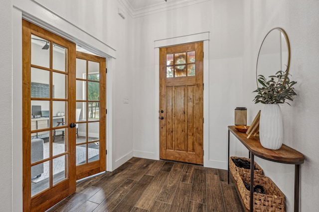 entryway with french doors, dark hardwood / wood-style floors, ornamental molding, and a healthy amount of sunlight