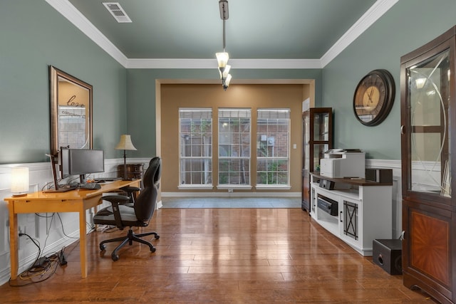 home office featuring crown molding and hardwood / wood-style floors