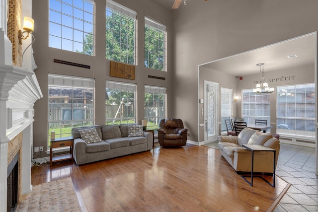 living room featuring a fireplace, hardwood / wood-style floors, and a healthy amount of sunlight